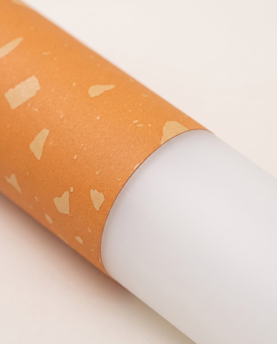 Close-up of the flecked orange filter section meeting the white opal tube